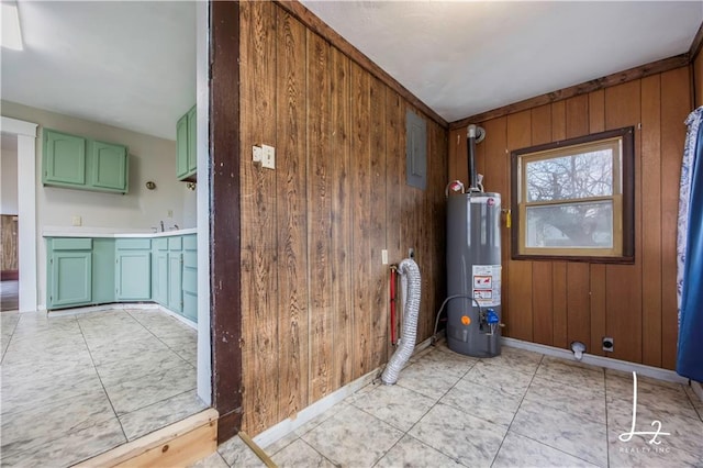 doorway featuring sink, electric panel, wood walls, and water heater