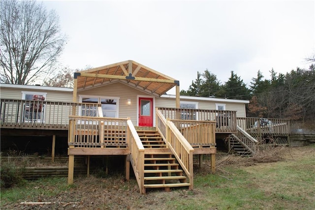 rear view of property with a wooden deck