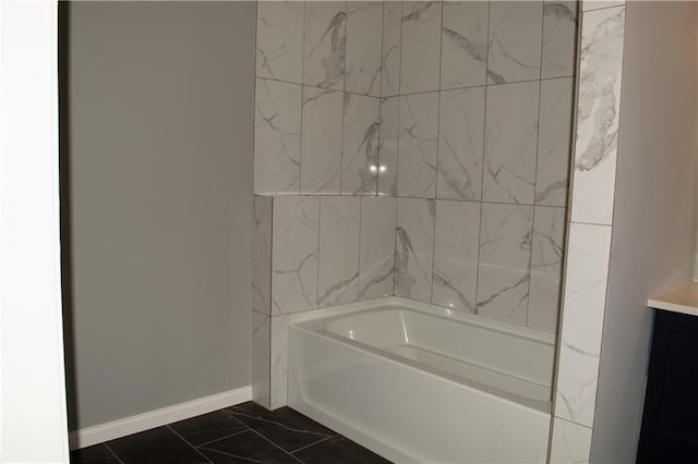 bathroom featuring a tub to relax in and vanity