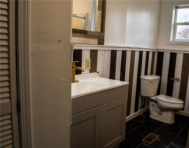 bathroom with vanity and toilet