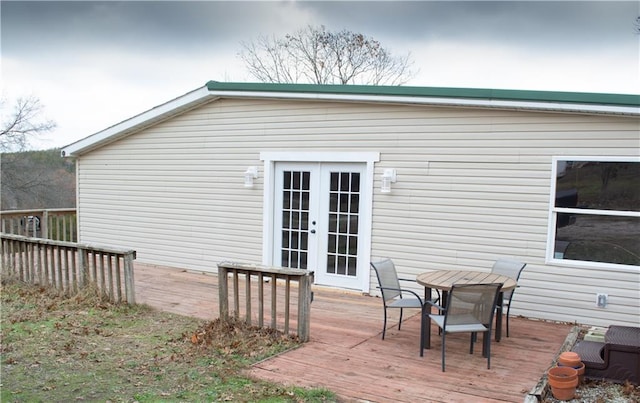 wooden deck featuring french doors