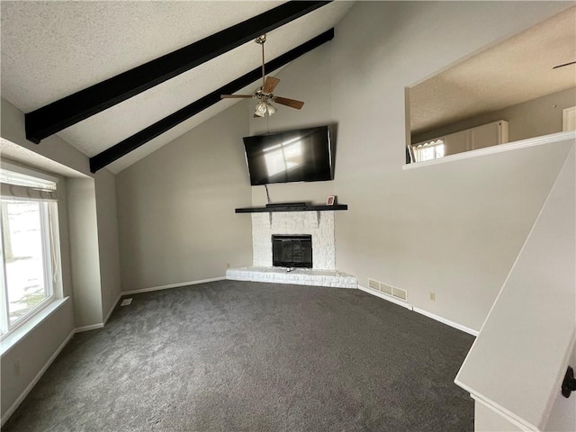 unfurnished living room featuring ceiling fan, carpet flooring, lofted ceiling with beams, and a brick fireplace