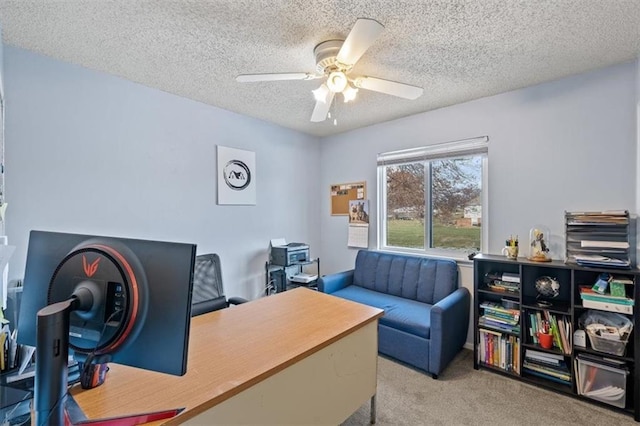 office area with light colored carpet, a textured ceiling, and ceiling fan