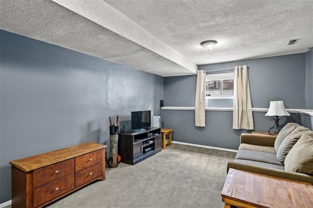 carpeted living room with a textured ceiling