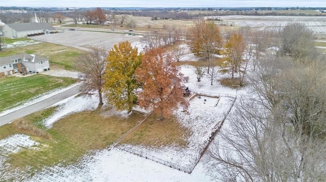 snowy aerial view featuring a rural view