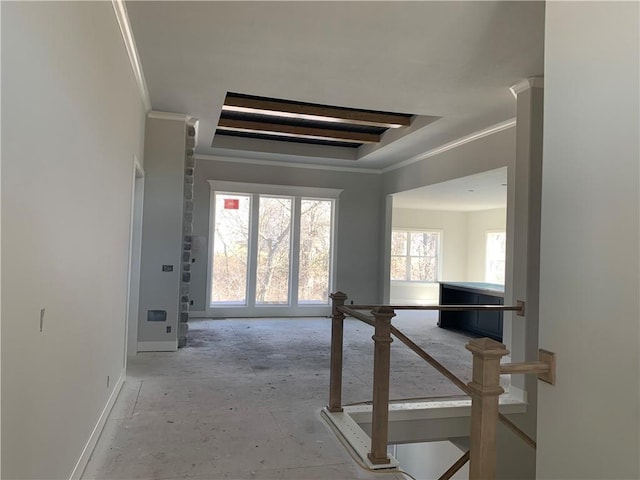 hallway with baseboards and ornamental molding