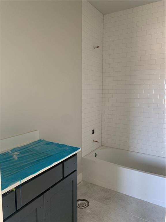 full bath featuring tile patterned floors and shower / washtub combination