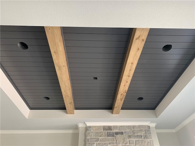 details featuring beam ceiling and ornamental molding