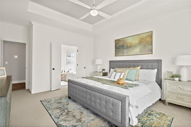 bedroom featuring a raised ceiling, ornamental molding, a ceiling fan, carpet floors, and baseboards