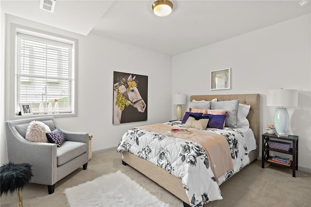 bedroom featuring visible vents, baseboards, and carpet floors