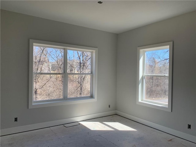 spare room featuring baseboards