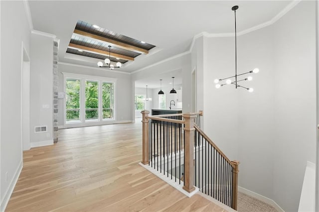 1406 NW 106th Ter, Kansas City, MO 64155 - hall with a chandelier, an upstairs landing, wood finished floors, and a wood ceiling with exposed beams