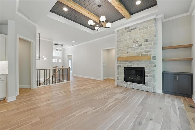 1406 NW 106th Ter, Kansas City, MO 64155 - unfurnished living room featuring a chandelier, light wood-style flooring, a wooden ceiling with exposed beams, a stone fireplace, and crown molding