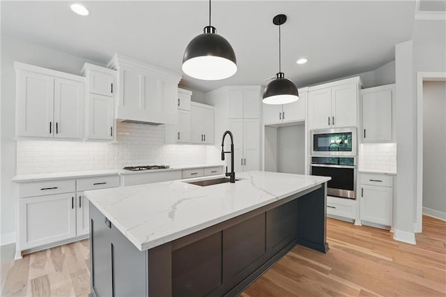 1406 NW 106th Ter, Kansas City, MO 64155 - kitchen with stainless steel appliances, decorative backsplash, white cabinetry, light wood-style flooring, and recessed lighting