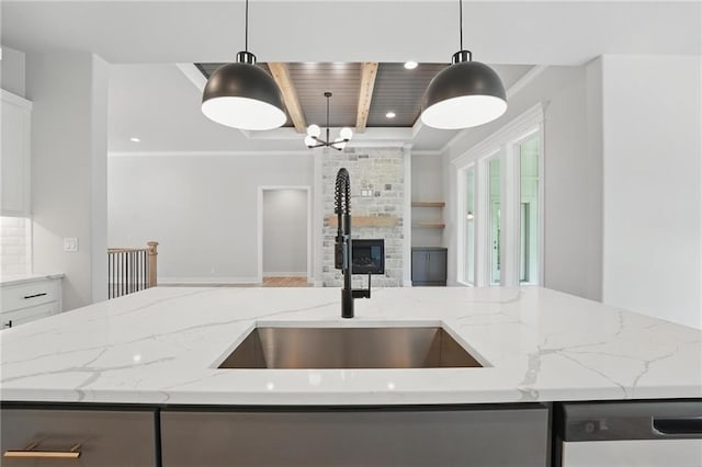 1406 NW 106th Ter, Kansas City, MO 64155 - kitchen featuring open floor plan, dishwasher, light stone counters, a fireplace, and pendant lighting
