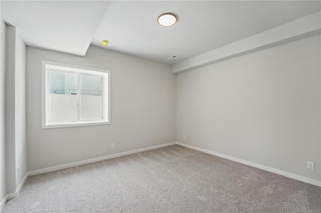 1406 NW 106th Ter, Kansas City, MO 64155 - spare room featuring light colored carpet and a smoke detector