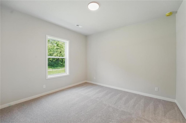 1406 NW 106th Ter, Kansas City, MO 64155 - carpeted empty room with baseboards and a smoke detector
