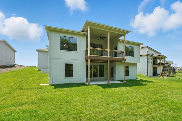1406 NW 106th Ter, Kansas City, MO 64155 - rear view of property with a ceiling fan, a patio area, a balcony, and a yard