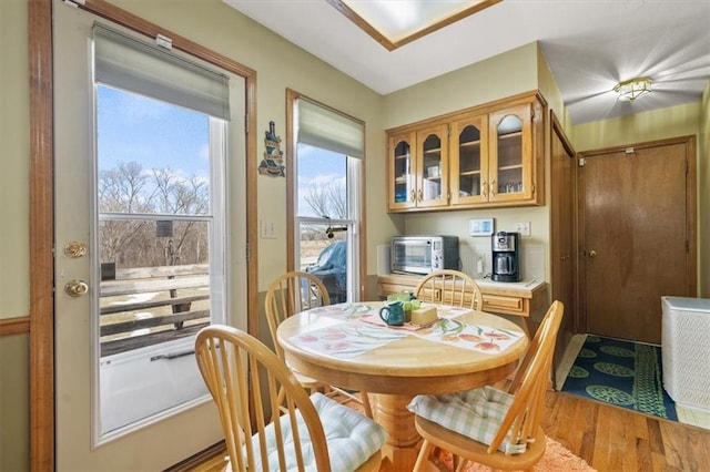 dining area featuring light wood-style floors