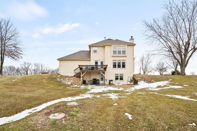 back of property featuring stairway, a deck, and a chimney