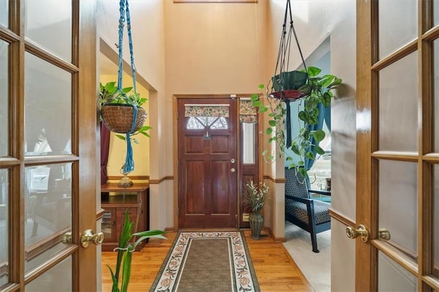 entrance foyer with french doors and wood finished floors