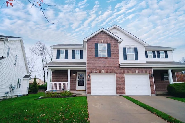 traditional home with a porch, a front yard, brick siding, and driveway