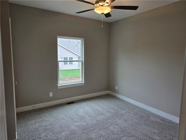 unfurnished room featuring carpet and ceiling fan