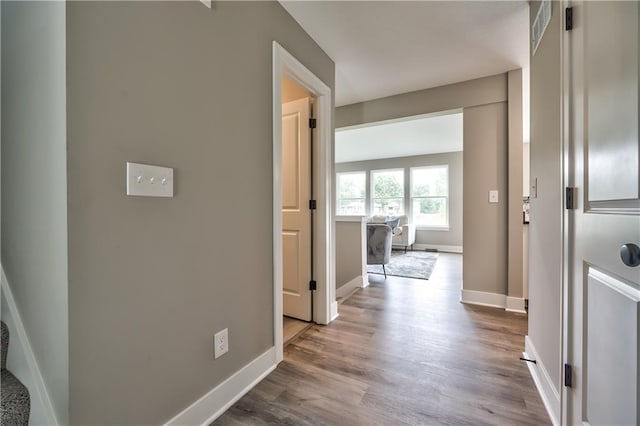 corridor with light hardwood / wood-style flooring