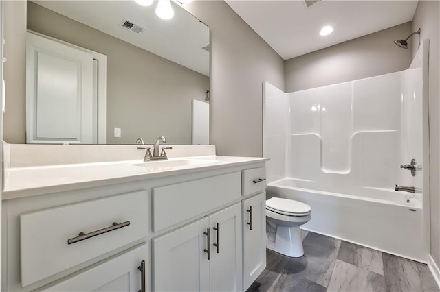 full bathroom with vanity, toilet, and shower / washtub combination