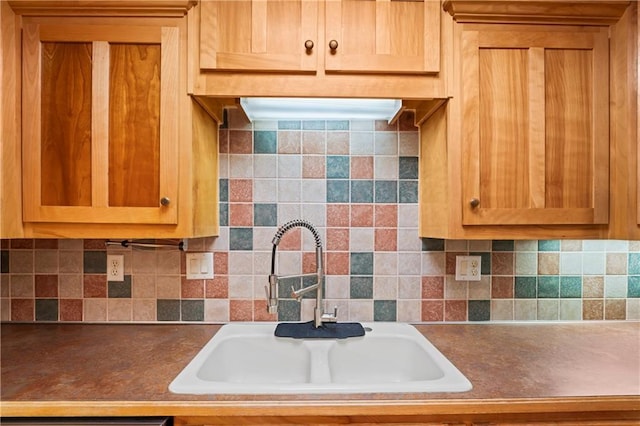 kitchen with decorative backsplash and sink