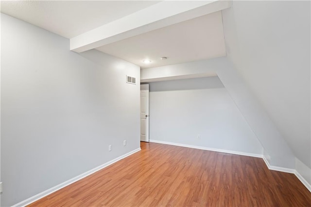 unfurnished room with hardwood / wood-style floors