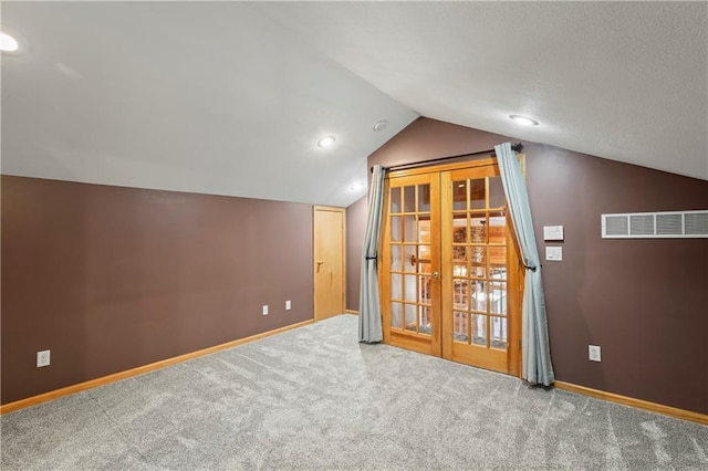 bonus room with carpet and lofted ceiling