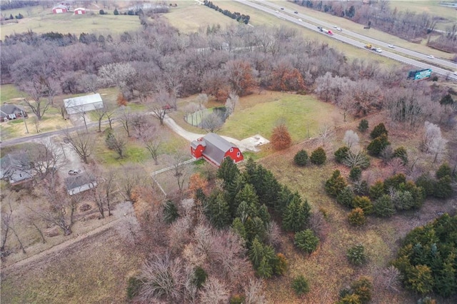 birds eye view of property with a rural view