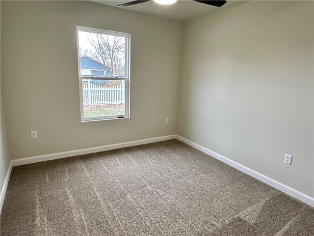 carpeted empty room with ceiling fan