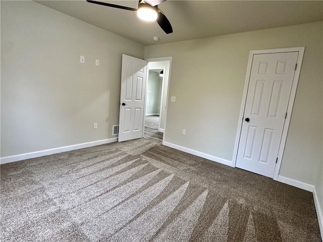 unfurnished bedroom with carpet floors and ceiling fan