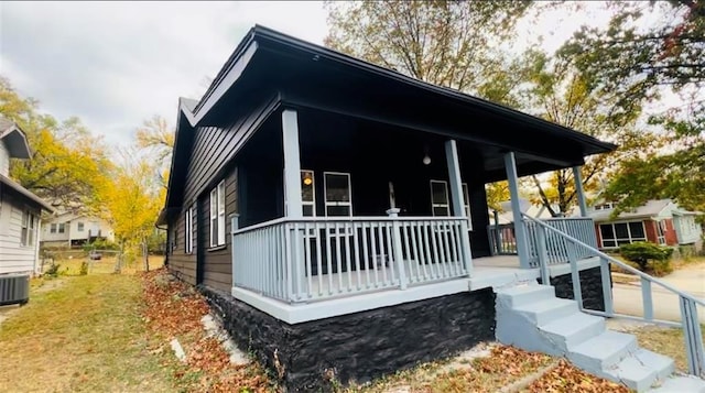 exterior space featuring cooling unit and covered porch