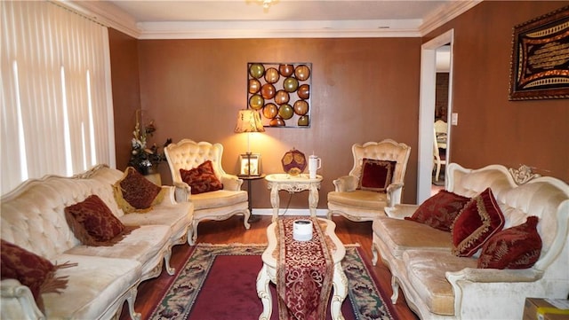 living room with hardwood / wood-style flooring and crown molding