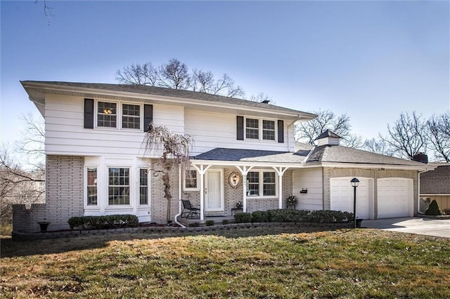 view of front facade featuring a front yard and a garage