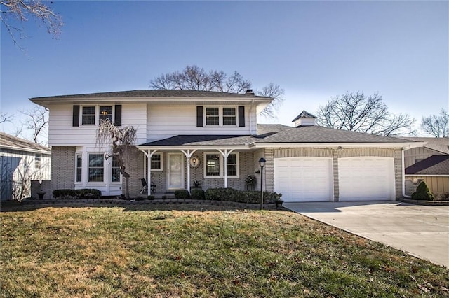 view of front property featuring covered porch, a front yard, and a garage