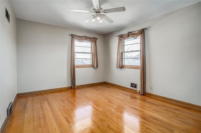 unfurnished room with light hardwood / wood-style flooring and ceiling fan