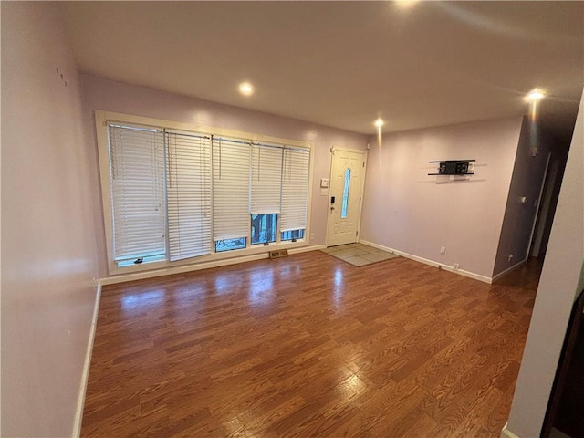 empty room with wood-type flooring