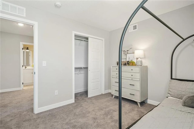 carpeted bedroom with a closet