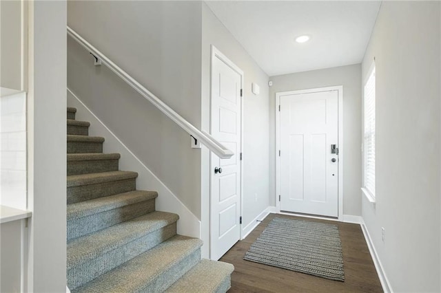 entryway with dark hardwood / wood-style floors