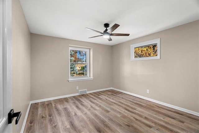 unfurnished room featuring light hardwood / wood-style floors and ceiling fan