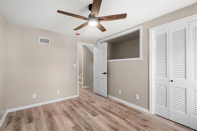 unfurnished bedroom featuring a closet, ceiling fan, and light hardwood / wood-style flooring