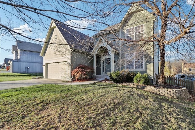 view of front property with a garage and a front lawn