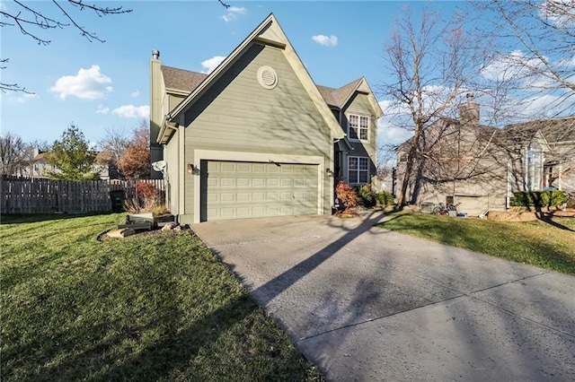 view of front of property featuring a garage and a front lawn