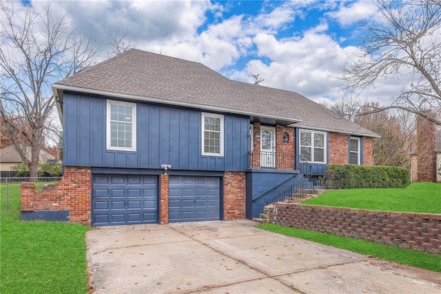 view of front of home with a garage and a front yard