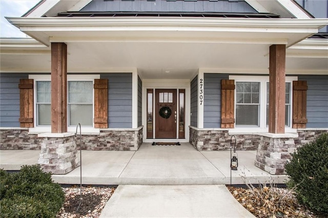 entrance to property with covered porch