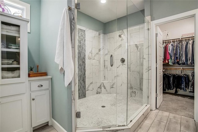 bathroom with a shower with shower door